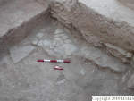 L_V16d3203 A15v247c N827 jJJ x stones and sherds at floor level